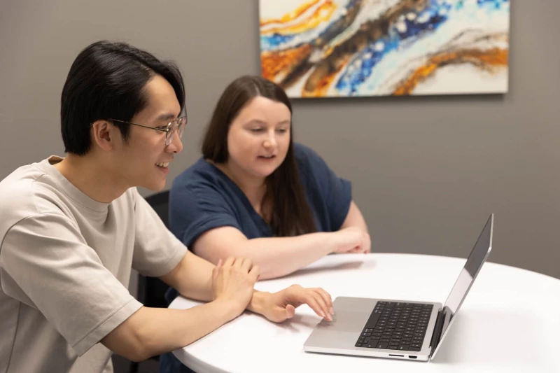 Mackenze and Spencer looking at a computer