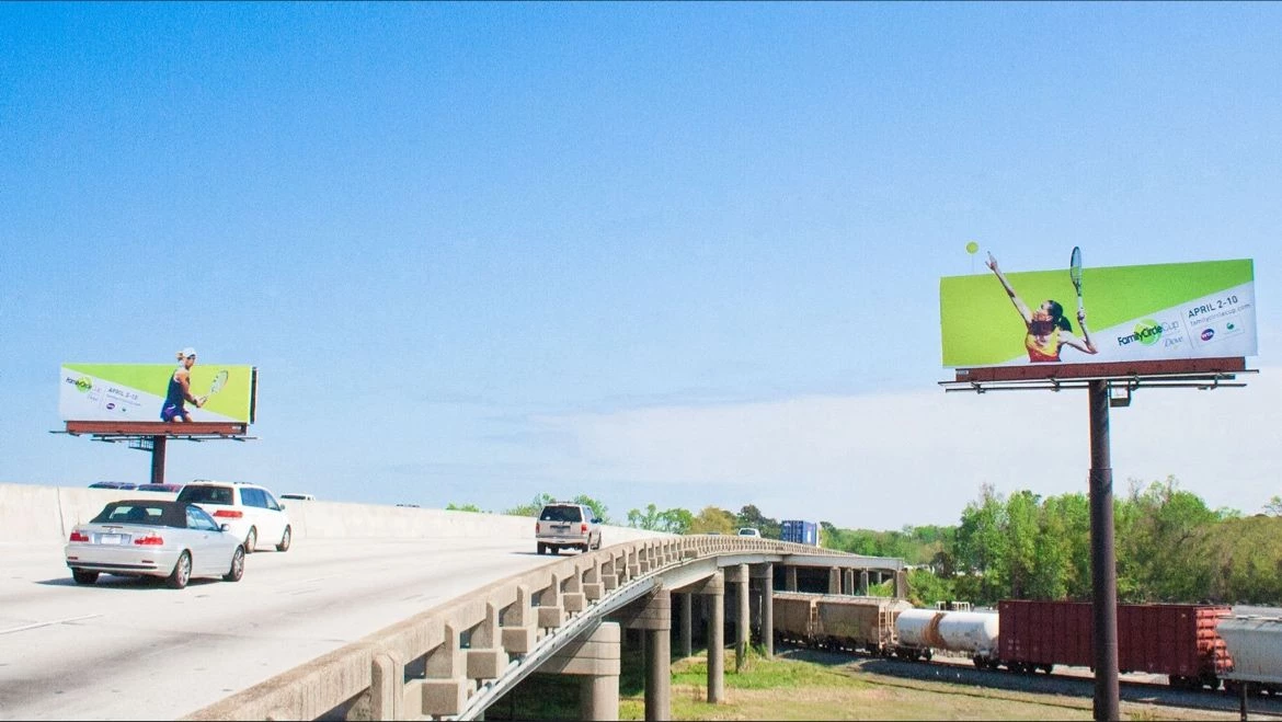 freeway overpass with billboards on either side of them