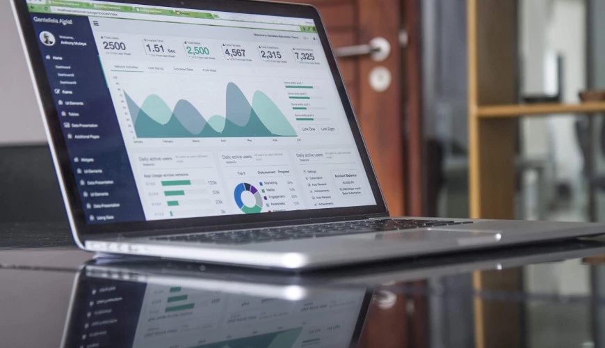 Image of a laptop with a dashboard showing