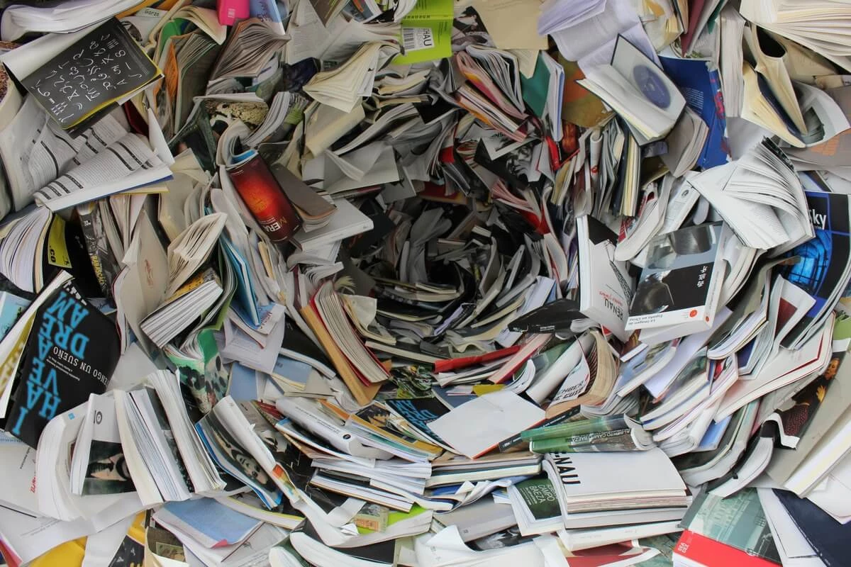 A pile of books in a vortex shape.