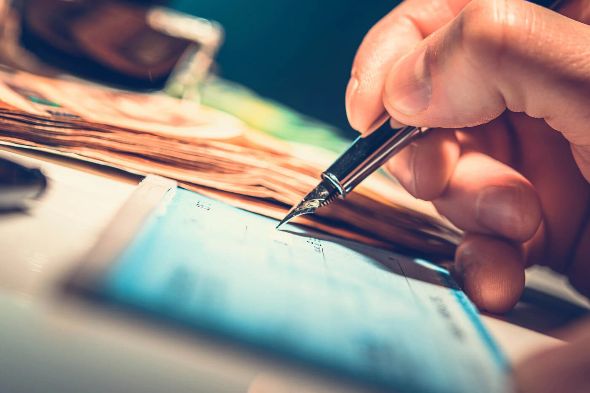 man writing a check