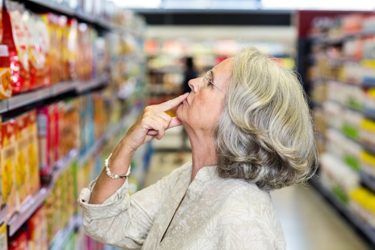 woman shopping for food in grocery store