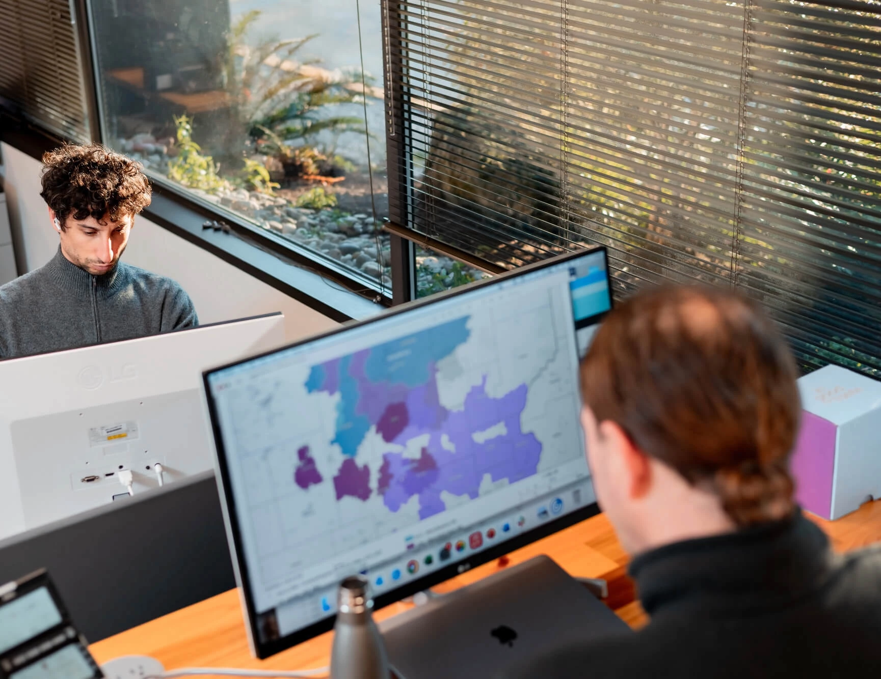 Max and Chris working with a computer map - Trainman Photography