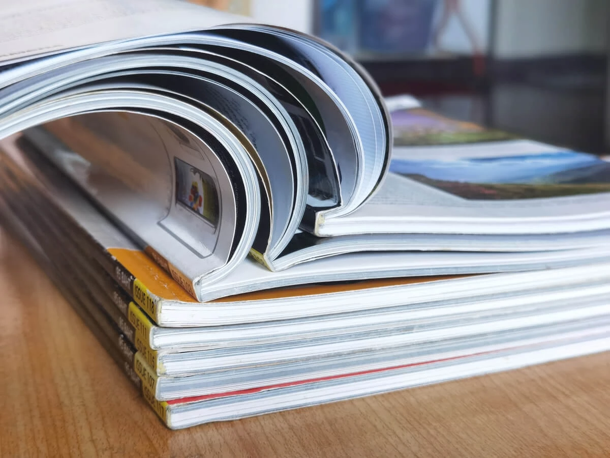 Stack of open magazines