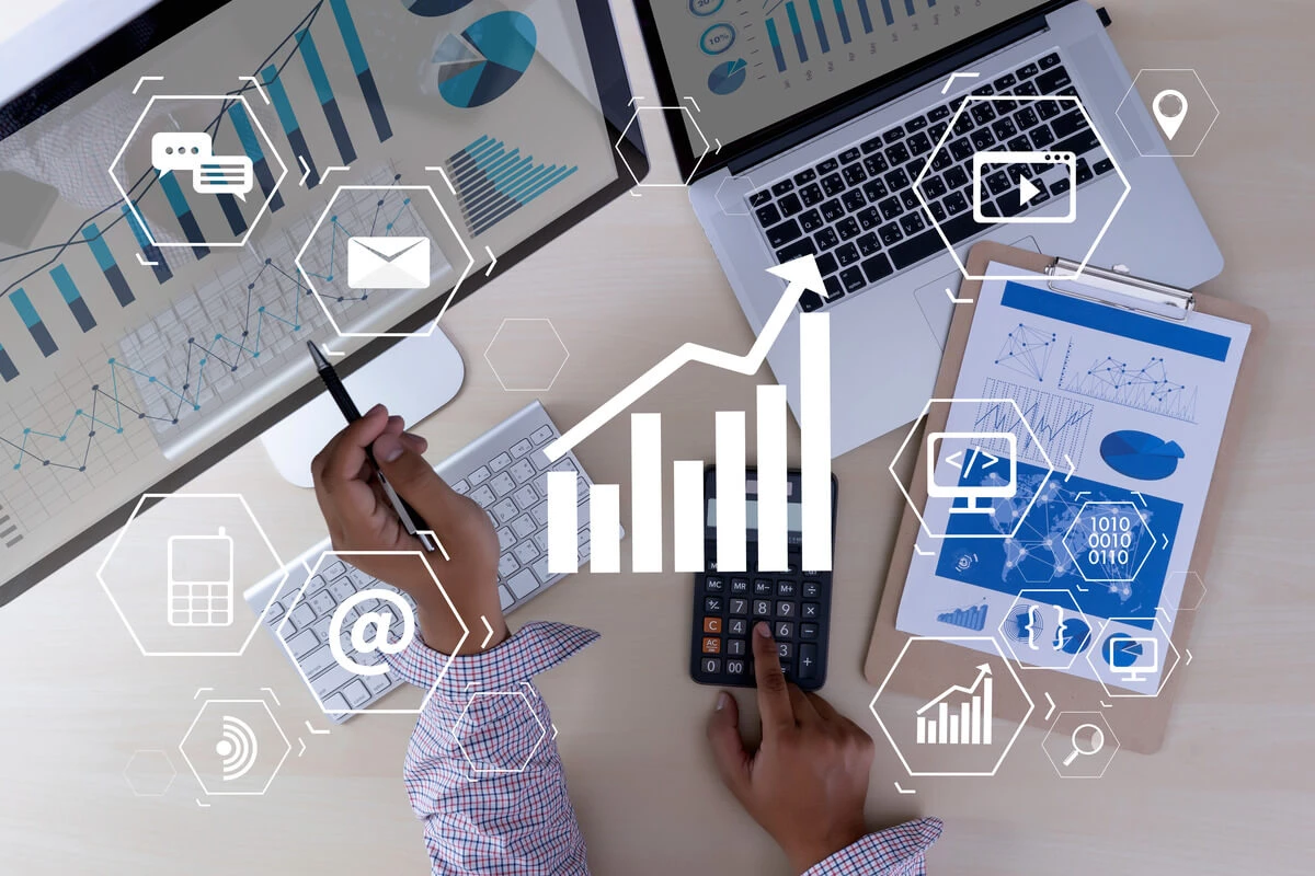 monitors and screen with charts and data overlayed