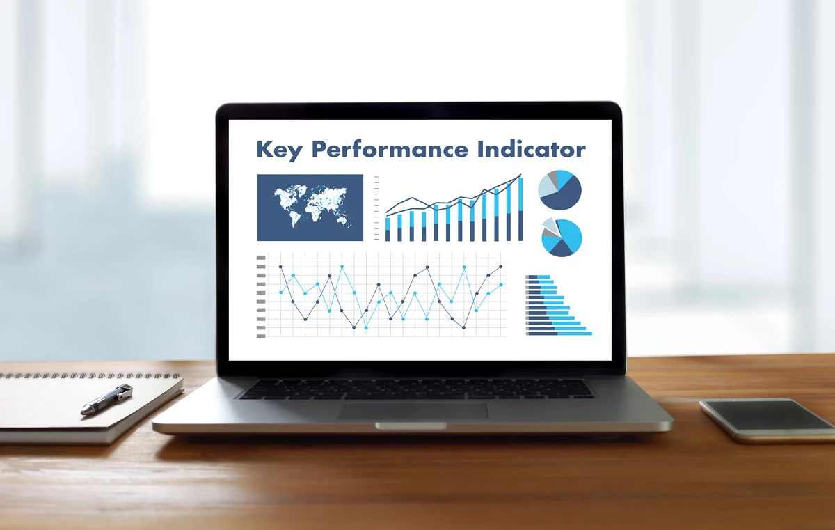 Image of laptop monitor with Key Performance Indicator title and charts and graphs