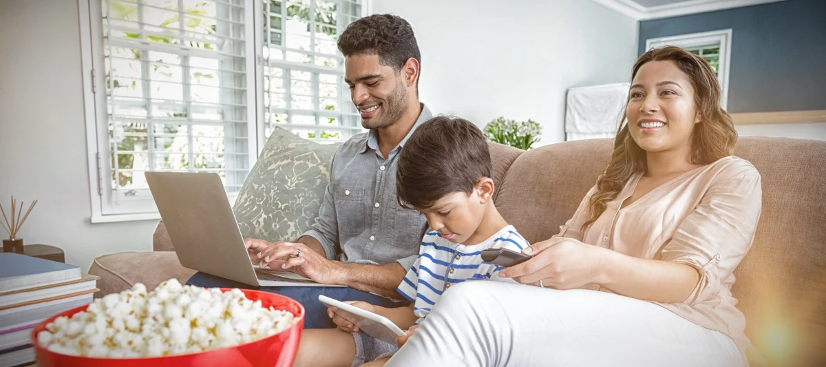family watching different tv devices